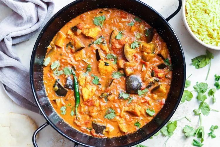 A rich and satisfying low-calorie curry recipe, with tender chicken and smoky aubergine in a spiced tomato sauce.