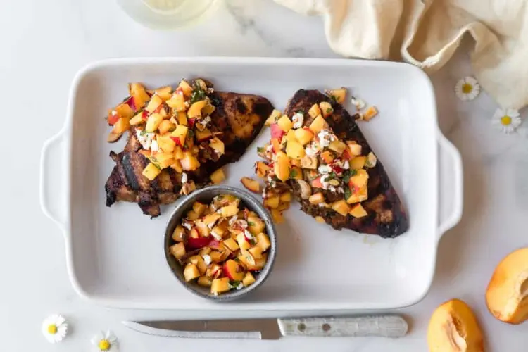 rilled chicken breasts marinated in a sweet and tangy bbq marinade, topped with fresh nectarine salsa and coriander.