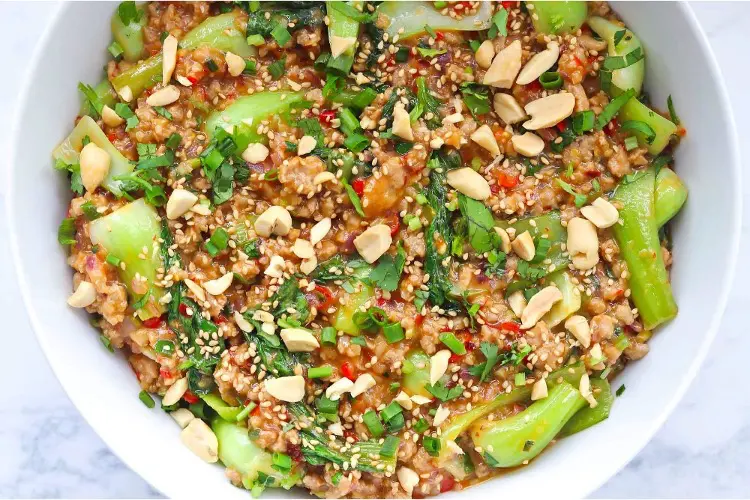 A bowl of pork mince stir-fry in peanut sauce—one of the most flavourful pork mince recipes.