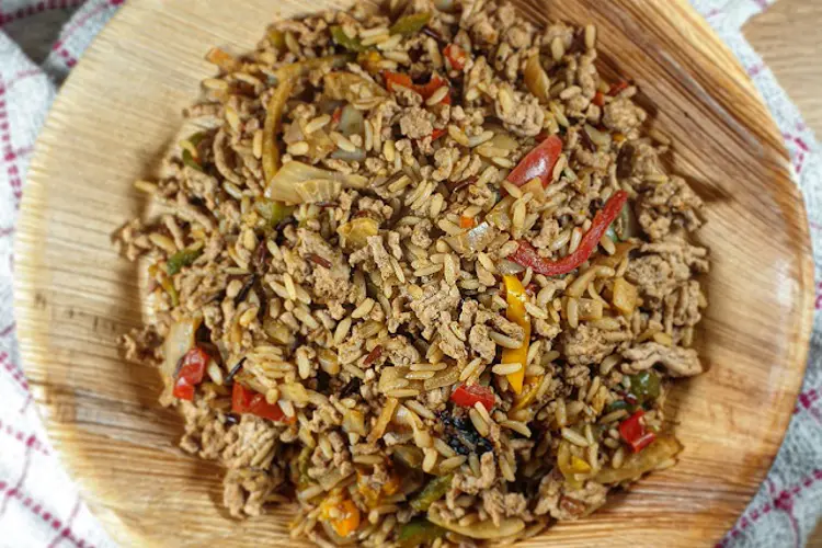 A bowl of pork mince dirty rice with peppers and seasoning—one of the best pork mince recipes for meal prep.