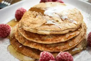 Delicious protein pancake topped with maple syrup.