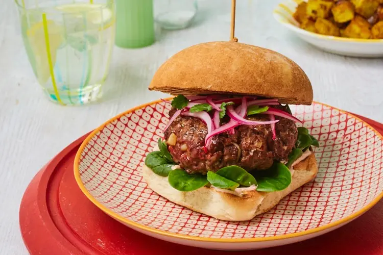 A juicy minced beef burger stacked with salsa, jalapeños, and guacamole, a Tex-Mex-inspired minced beef recipe