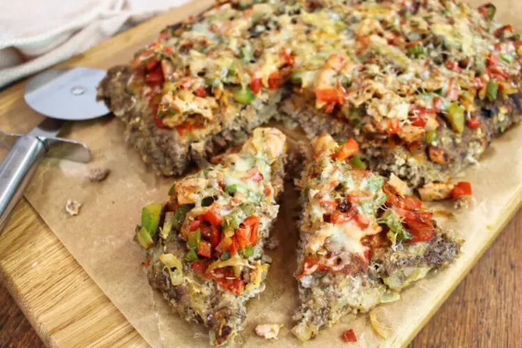 photo of sliced meatza