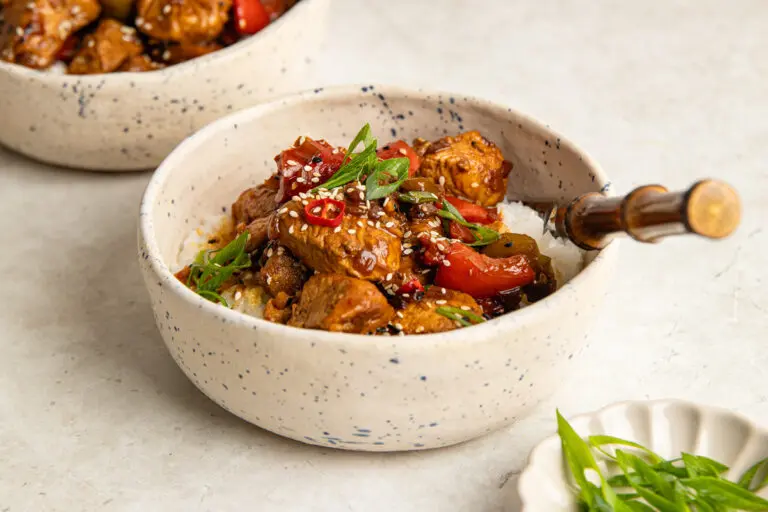 Sticky Korean chicken breast with rice, peppers and a sweet and spicy gochujang sauce.