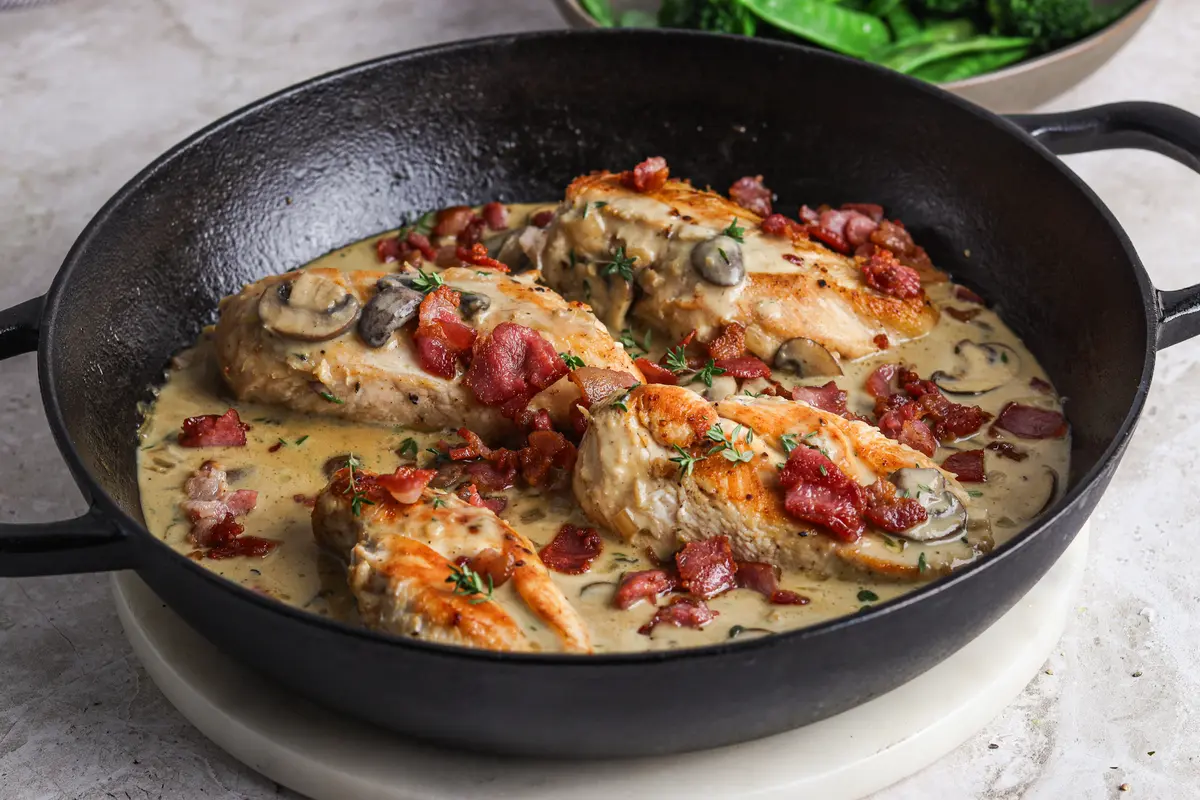 Close-up of Chicken Supreme with Bacon, showcasing golden chicken and creamy sauce.