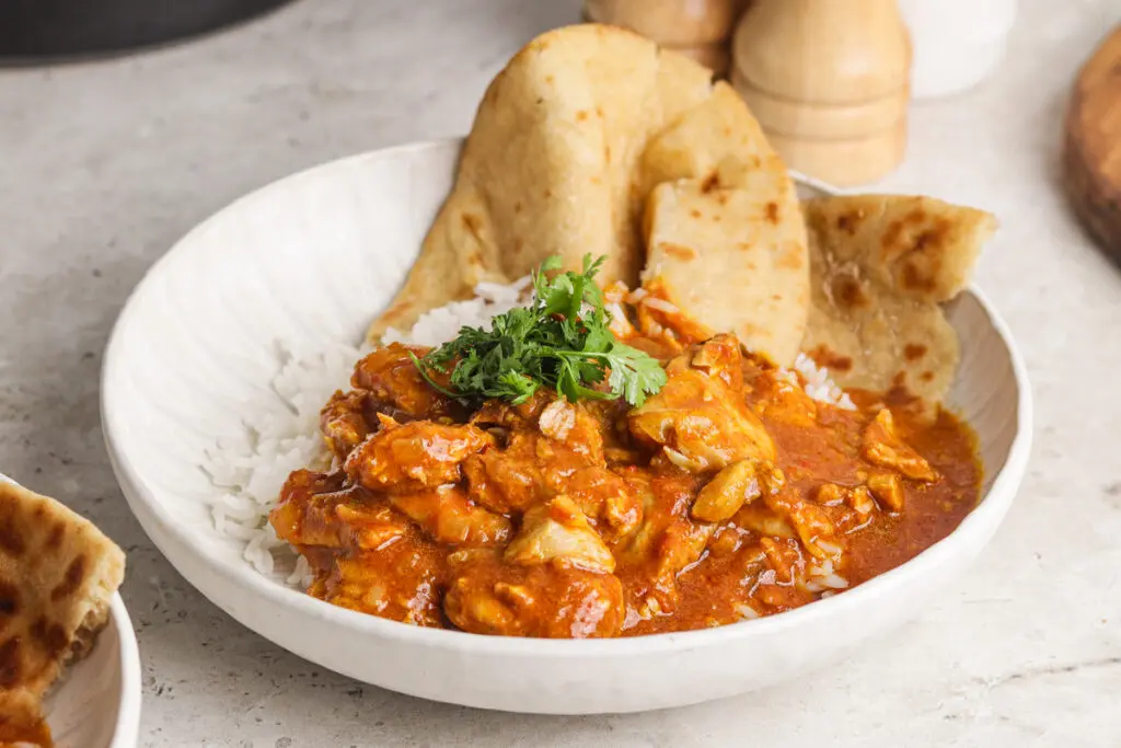 Close-up of slow cooker chicken curry with tender chicken and thick, flavourful curry sauce