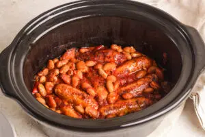Slow cooker sausage casserole with chicken sausages and butterbeans in a rich tomato sauce