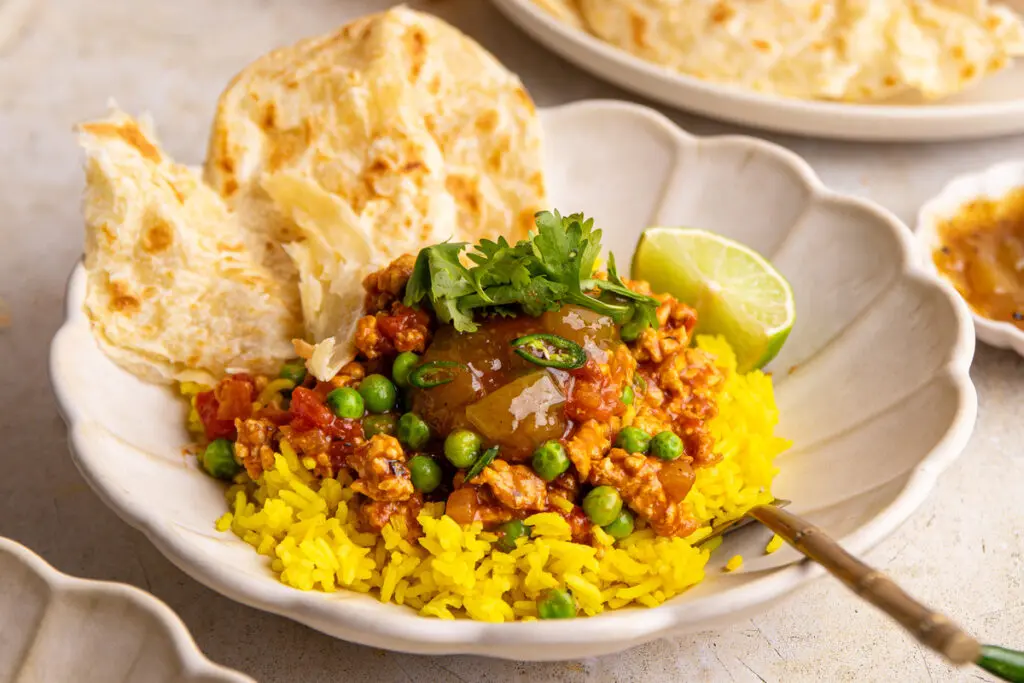 Close-up chicken keema bowl showing rich curry sauce and minced chicken texture