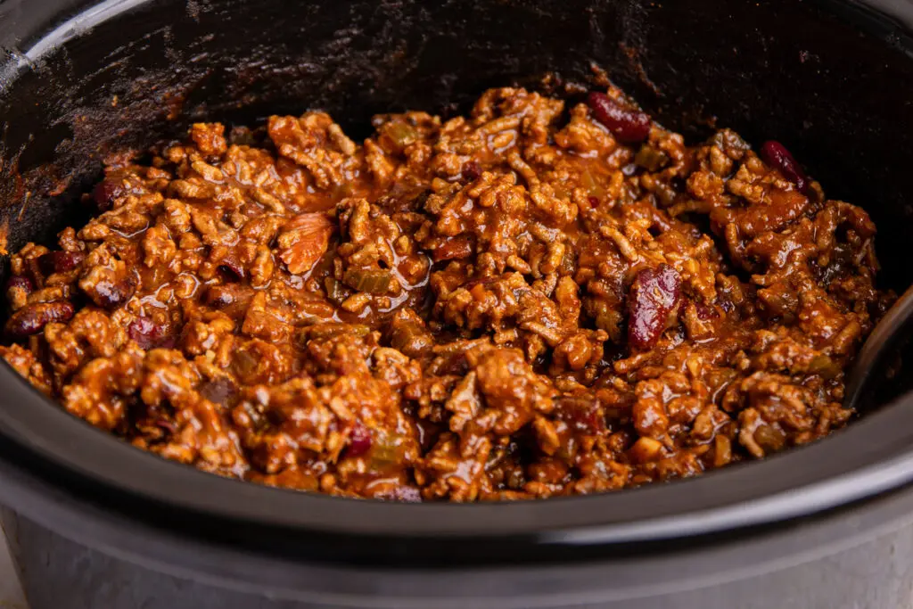 Close-up of slow cooker chilli con carne showing beef mince and kidney beans