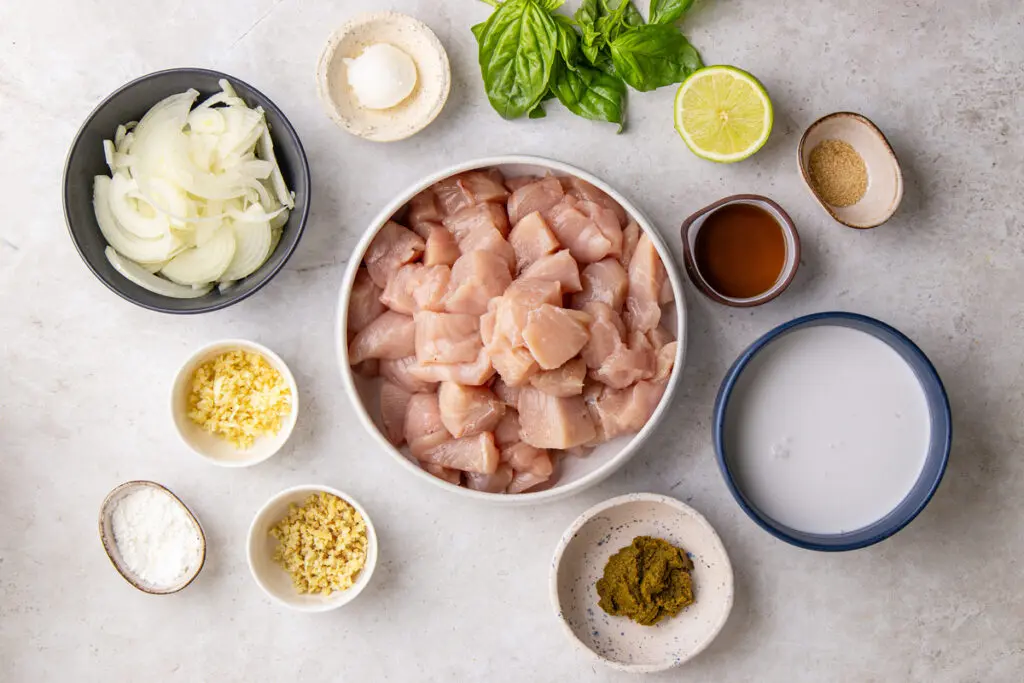Ingredients for slow cooker Thai green chicken curry with chicken, coconut milk and lime