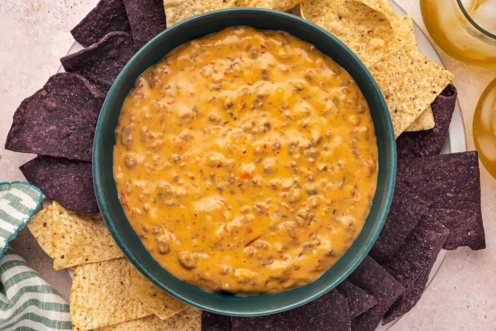 A rich, creamy slow cooker mince recipe loaded with seasoned beef and melted cheese, served as a warm dip with blue and classic tortilla chips. Proper Friday-night sharing food with very little effort.