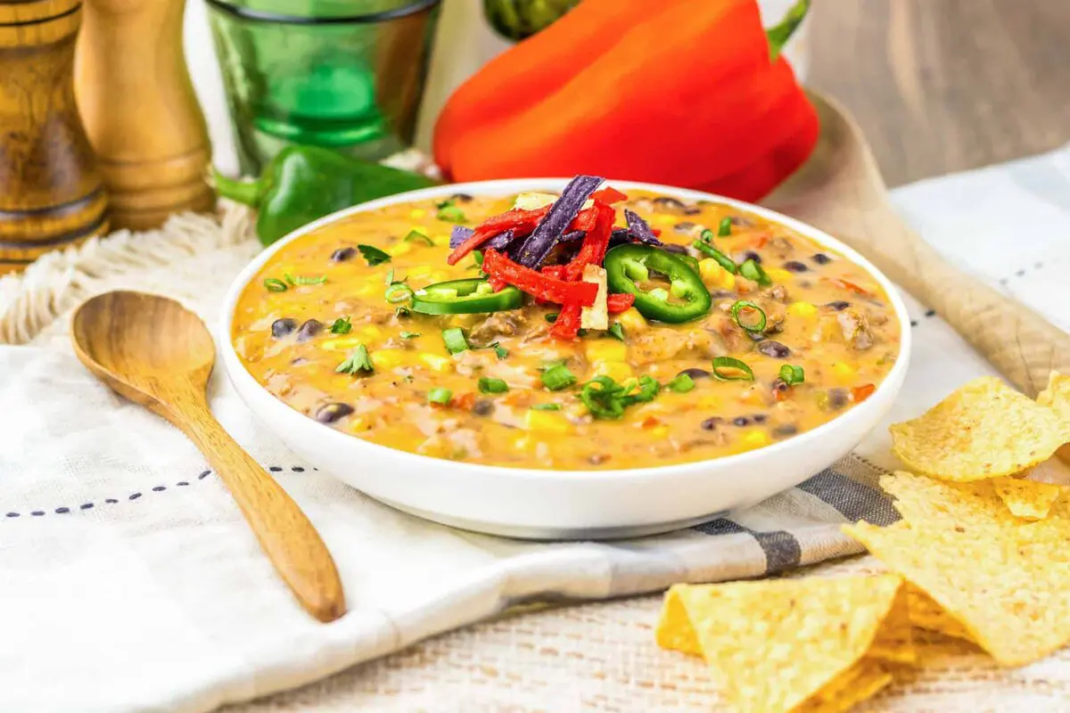 This creamy nacho soup combines seasoned mince, black beans, sweetcorn and plenty of cheesy goodness in one gloriously comforting bowl. It’s a slow cooker mince recipe made for dunking tortilla chips straight into — cutlery very much optional.