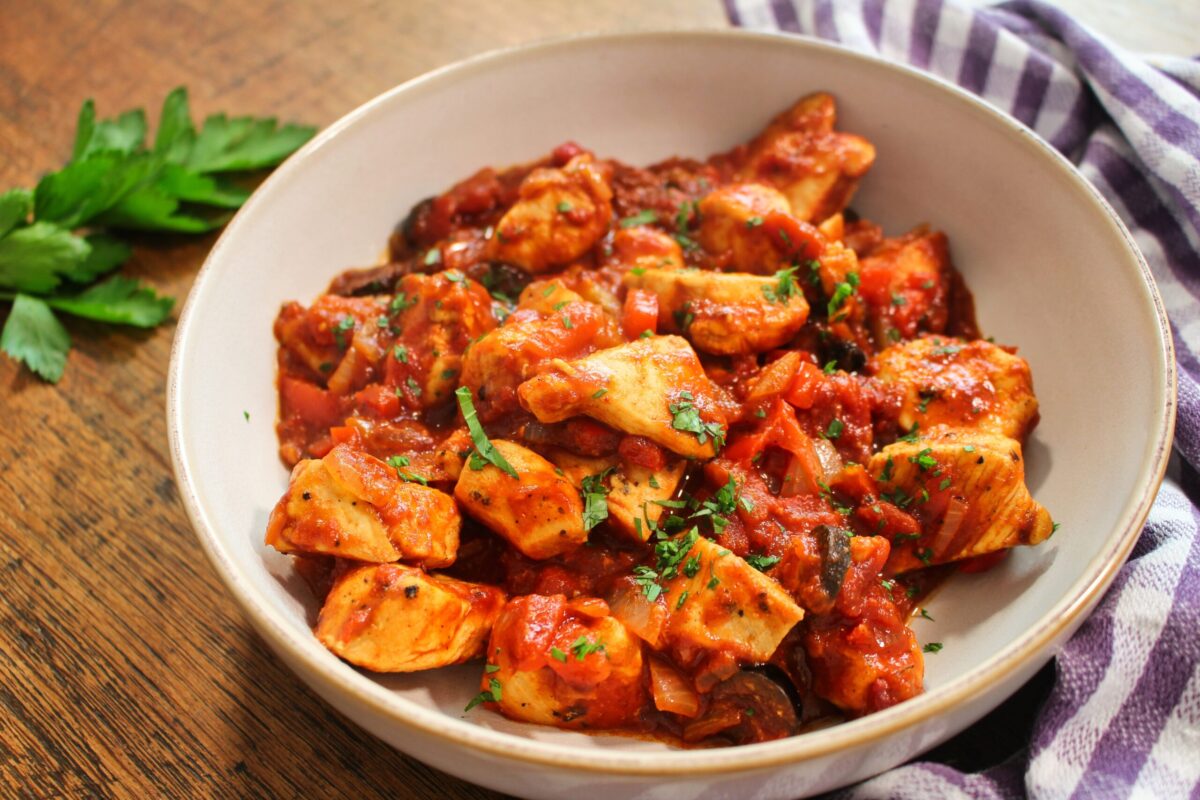 Hearty chicken stew with vegetables and tomatoes, warming dinner recipe